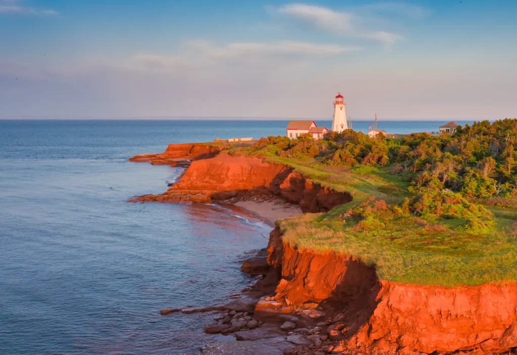 Lighthouse overlooking red cliffs and the sea on Prince Edward Island