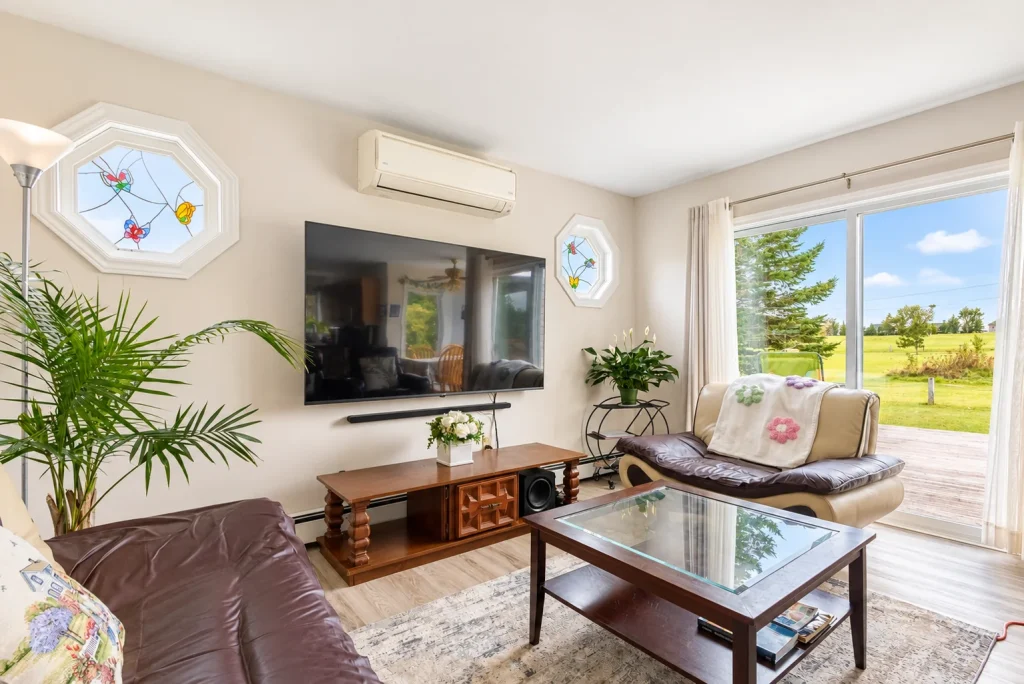Home theatre with large television and garden-facing windows